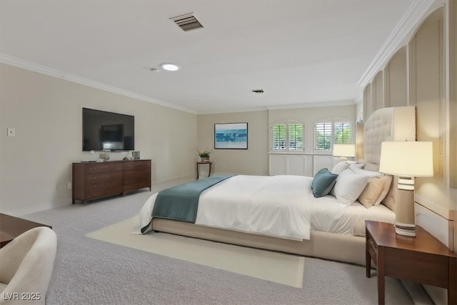 bedroom with light carpet, ornamental molding, visible vents, and baseboards