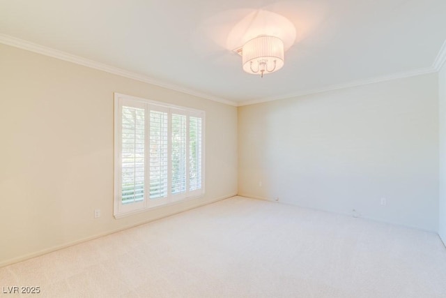 carpeted empty room featuring crown molding