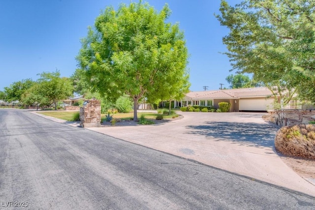 view of front of property featuring driveway and an attached garage