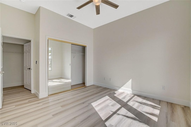 unfurnished bedroom featuring visible vents, ceiling fan, baseboards, and wood finished floors