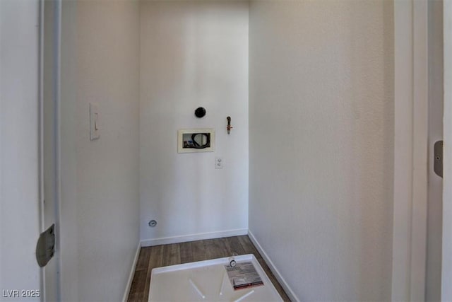 washroom featuring laundry area, hookup for a washing machine, dark wood finished floors, and baseboards