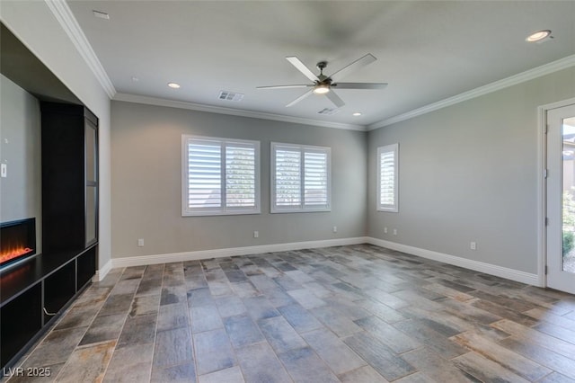 unfurnished living room featuring a ceiling fan, visible vents, crown molding, and a lit fireplace