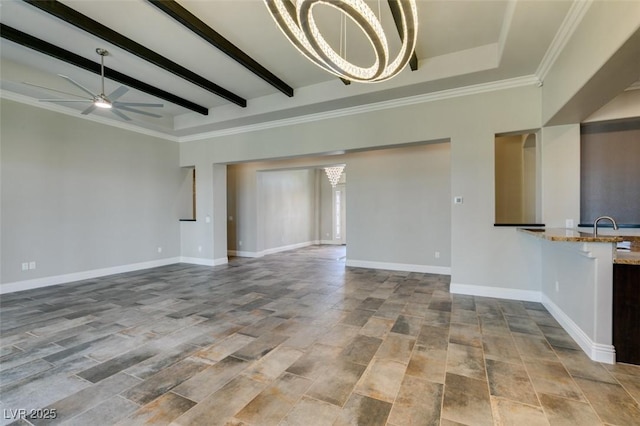 unfurnished living room with a sink, beamed ceiling, baseboards, and ceiling fan with notable chandelier