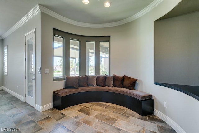 living room with ornamental molding, recessed lighting, stone finish floor, and baseboards