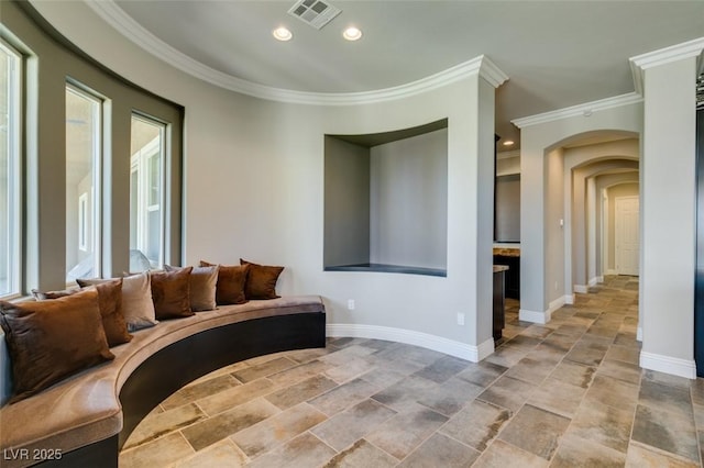 living area with crown molding, recessed lighting, visible vents, and baseboards