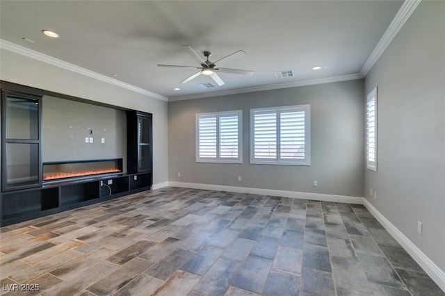 unfurnished living room with baseboards, visible vents, a glass covered fireplace, crown molding, and recessed lighting