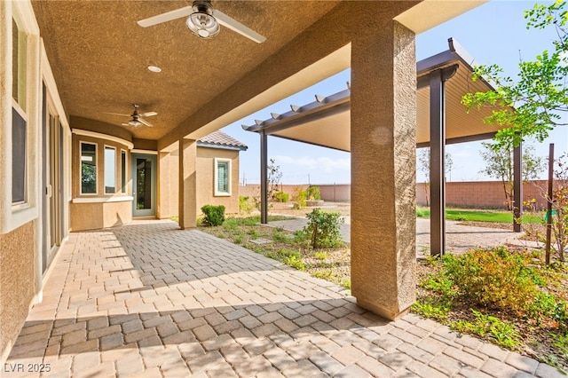 view of patio featuring a fenced backyard and ceiling fan