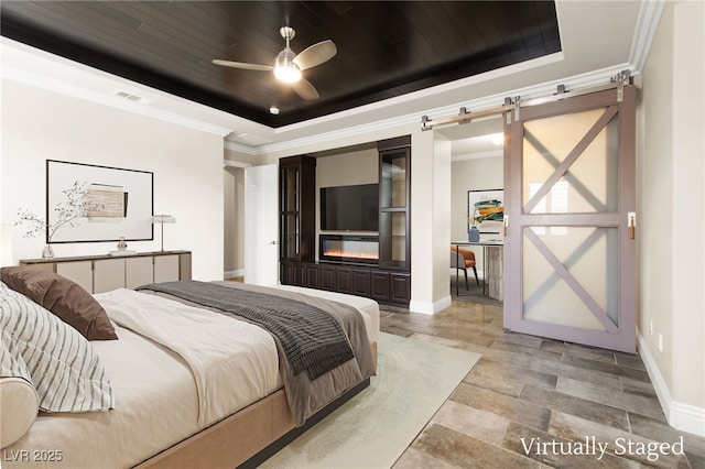 bedroom with a tray ceiling, crown molding, wooden ceiling, a barn door, and visible vents