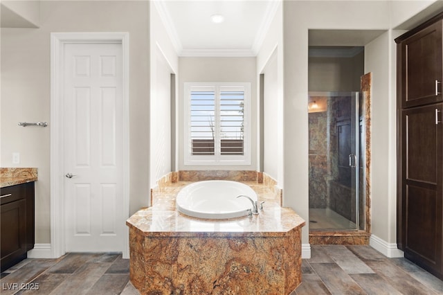 full bath featuring vanity, a shower stall, crown molding, and a bath