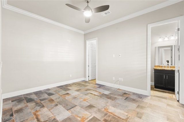 unfurnished bedroom featuring crown molding, baseboards, a sink, visible vents, and stone finish flooring
