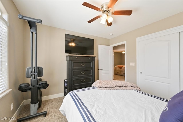 bedroom featuring baseboards, carpet, and a ceiling fan