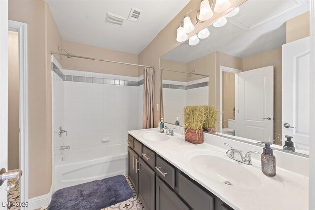 bathroom featuring shower / bath combo, visible vents, and a sink