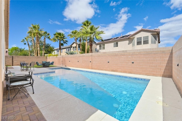 view of pool with a patio, a fenced backyard, and a fenced in pool