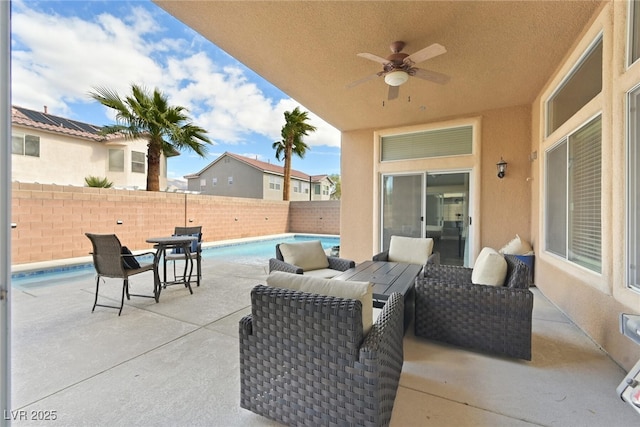 view of patio featuring a fenced backyard, a fenced in pool, and a ceiling fan