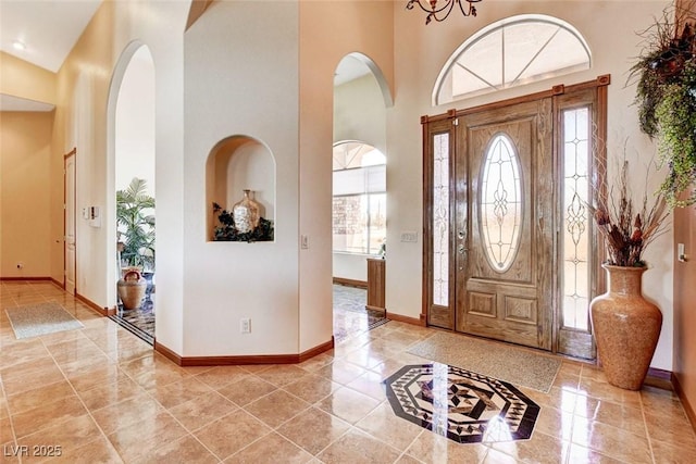 entrance foyer featuring plenty of natural light and a high ceiling