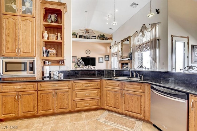 kitchen featuring lofted ceiling, stainless steel appliances, a sink, visible vents, and open shelves