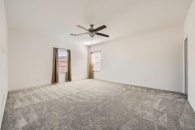 empty room featuring carpet floors, ceiling fan, and baseboards