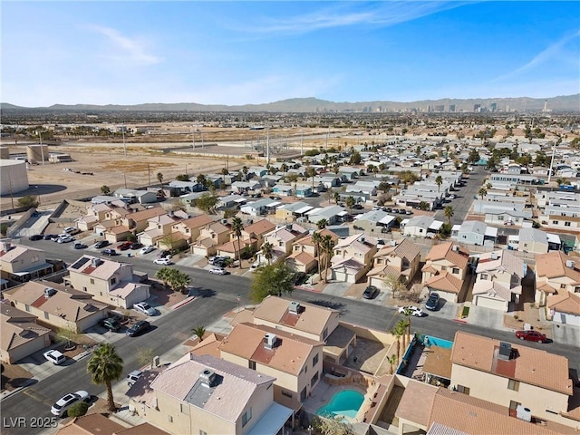 drone / aerial view featuring a residential view and a mountain view