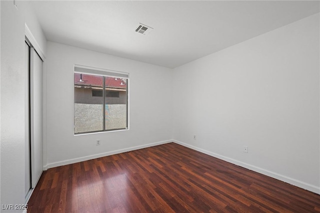 interior space featuring visible vents, baseboards, and wood finished floors