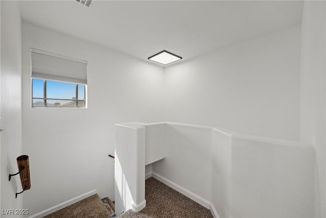 staircase with carpet and baseboards