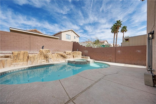 view of swimming pool featuring a patio, a fenced backyard, and a pool with connected hot tub