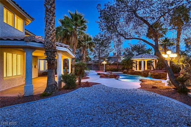 view of yard with a patio area and an outdoor pool