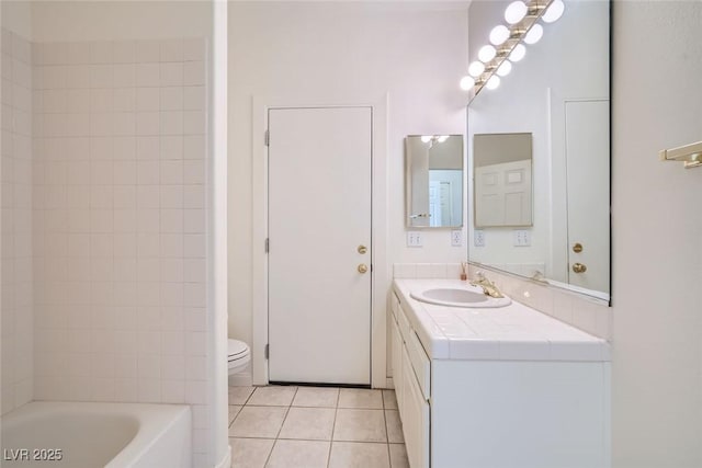 bathroom featuring vanity, toilet, and tile patterned floors