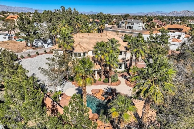 drone / aerial view featuring a mountain view and a residential view