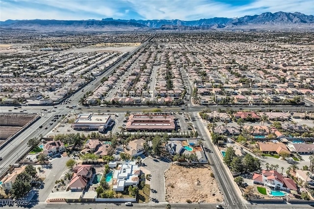 drone / aerial view featuring a residential view and a mountain view