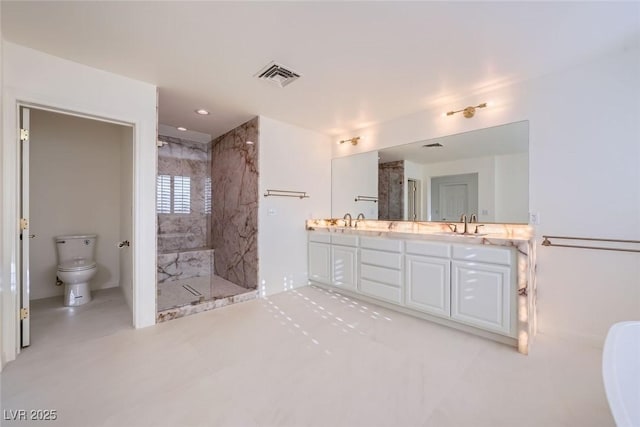 bathroom featuring toilet, a sink, visible vents, a marble finish shower, and double vanity