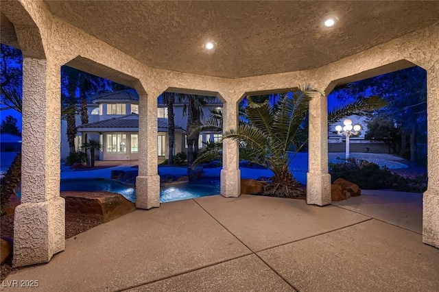 view of patio with an outdoor pool