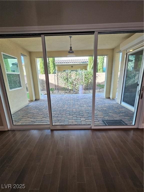 doorway to outside with dark wood finished floors