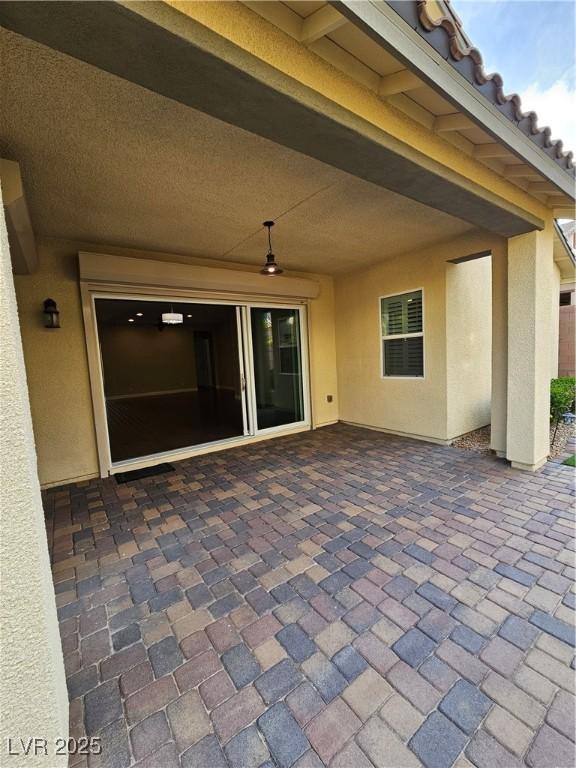 view of patio / terrace featuring ceiling fan