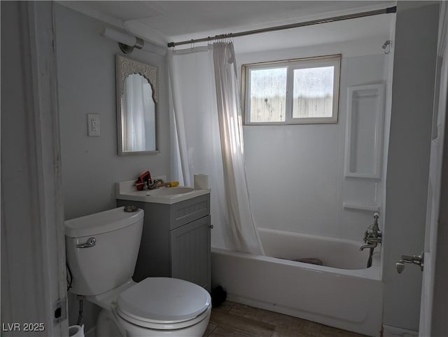 bathroom with toilet, shower / bath combo, and vanity