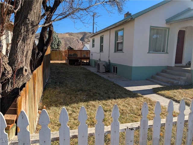 view of yard featuring fence private yard and a mountain view