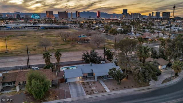 aerial view at dusk featuring a view of city