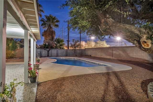 view of pool featuring a fenced backyard, a fenced in pool, and a patio