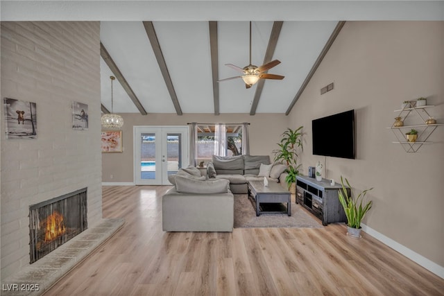 living room with baseboards, french doors, a fireplace, high vaulted ceiling, and beam ceiling