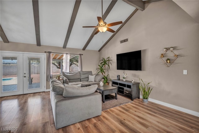 living room featuring baseboards, visible vents, wood finished floors, french doors, and beam ceiling