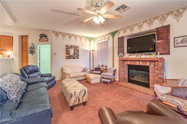 carpeted living area with a fireplace, visible vents, and ceiling fan