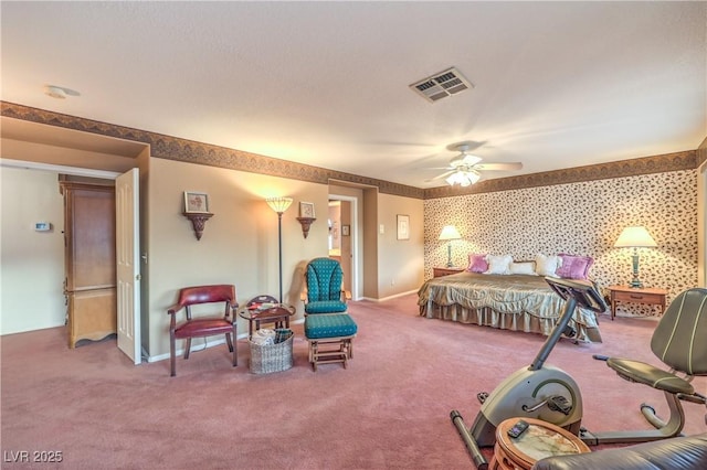 carpeted bedroom with visible vents, baseboards, ceiling fan, and wallpapered walls