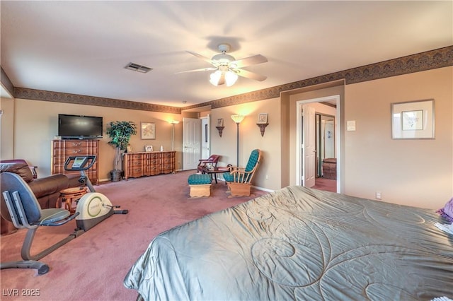 carpeted bedroom featuring visible vents and a ceiling fan