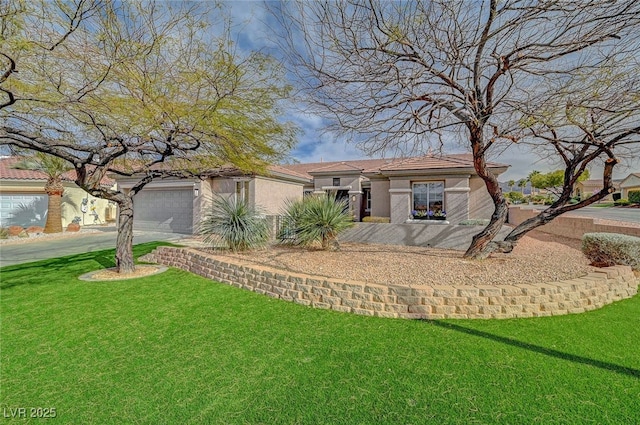 view of front facade with a garage, a front lawn, and stucco siding