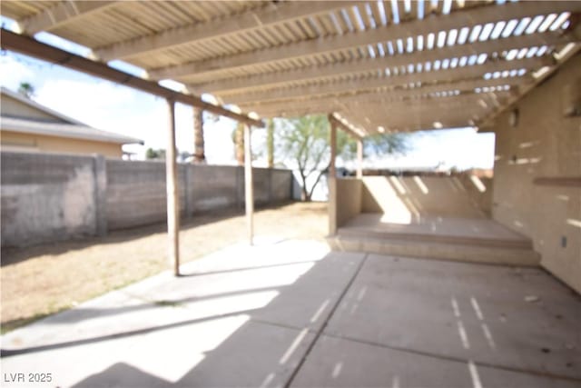 view of patio / terrace with fence and a pergola