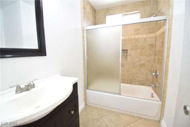 full bath featuring tile patterned flooring, bath / shower combo with glass door, and vanity