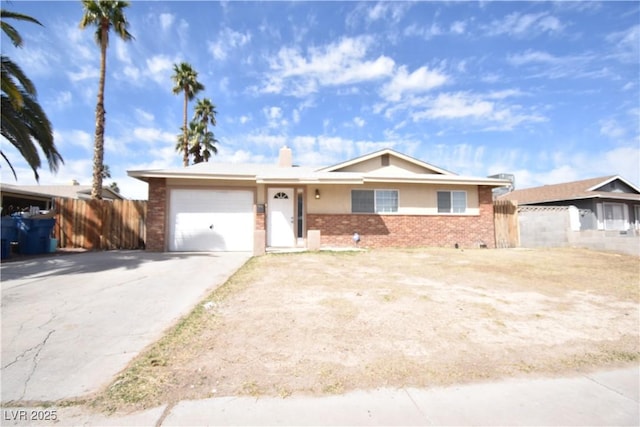 ranch-style home with a garage, brick siding, fence, and driveway