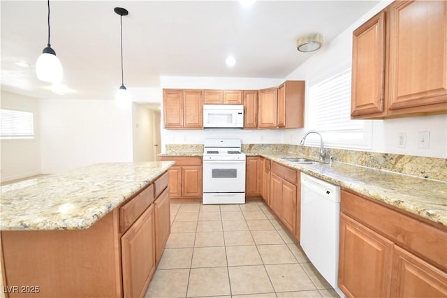 kitchen featuring light stone counters, white appliances, a sink, and light tile patterned floors