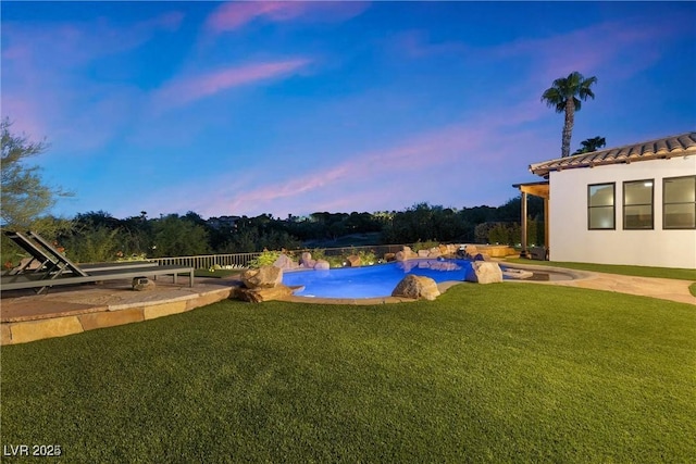 view of yard featuring a patio area and an outdoor pool