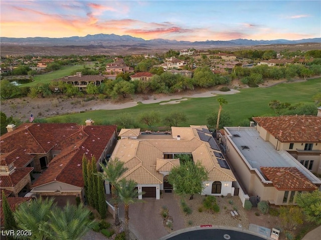 aerial view at dusk with a residential view and a mountain view