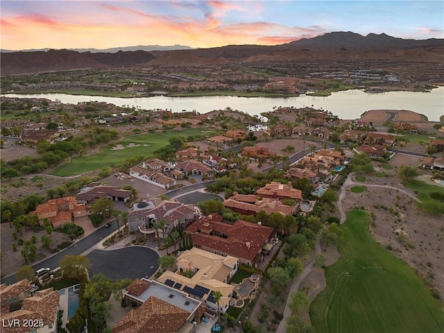 drone / aerial view featuring a residential view and a water and mountain view